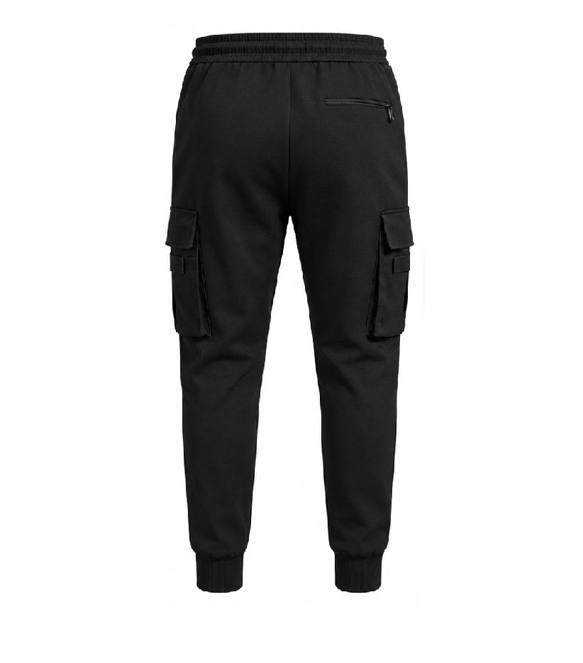 Black cargo jogger pants shown from the back, featuring an elastic waistband, zippered back pocket, and large cargo pockets on both legs, set against a plain white background.