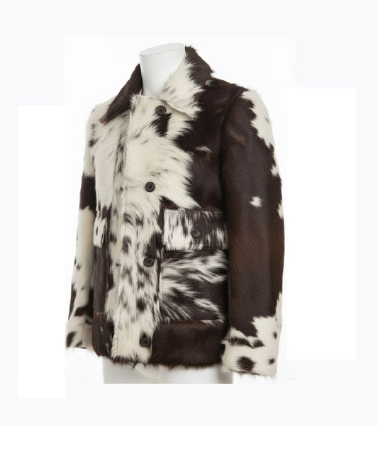 A cow-print faux fur jacket displayed on a white mannequin torso against a white background.