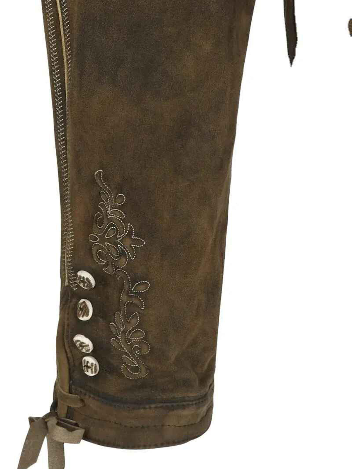 Close-up of embroidered suede leather lederhosen leg with zip detail and silver buttons