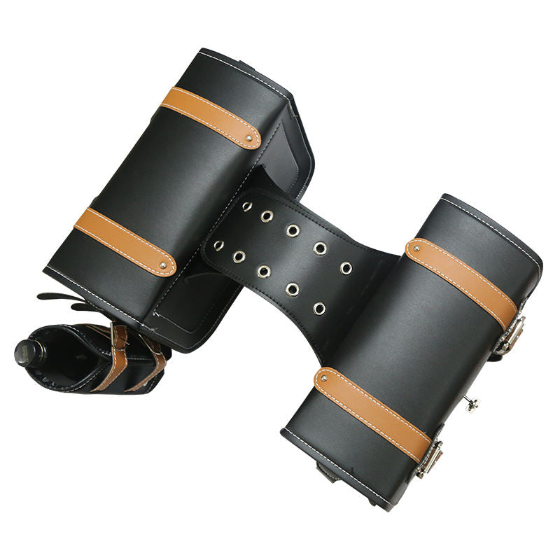 Black leather arm guards with brown accents on a white background