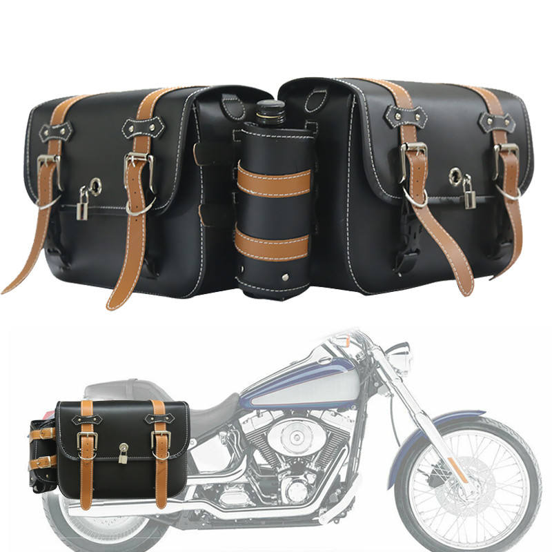 Black leather motorcycle saddlebags with brown straps on a white background