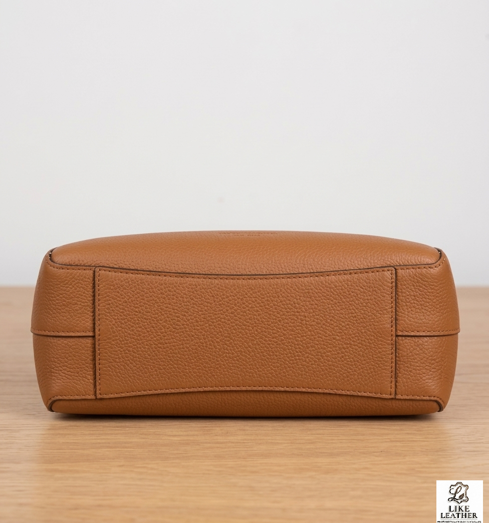  Bottom view of LIKE LEATHER bag showing reinforced structural piping and durable leather base construction