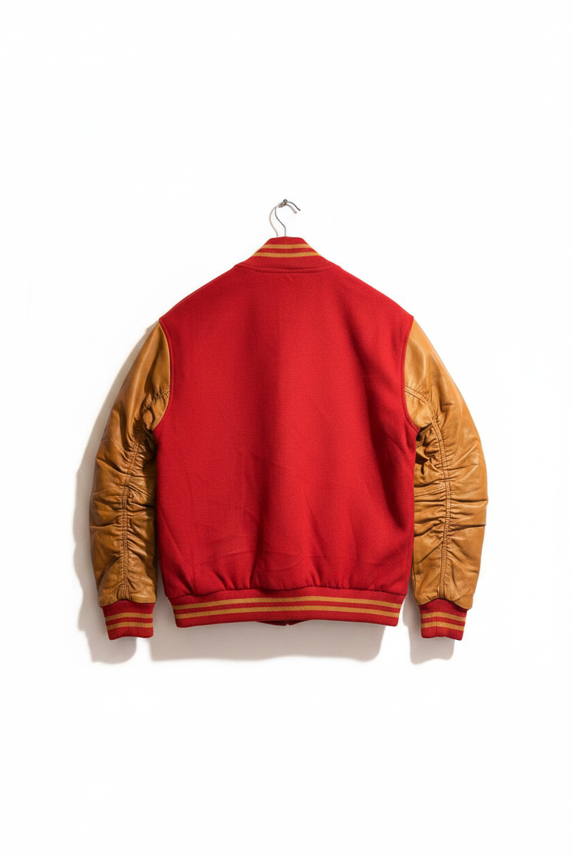 A red and tan varsity-style jacket shown from the back, hanging on a metal hanger against a plain white background.
