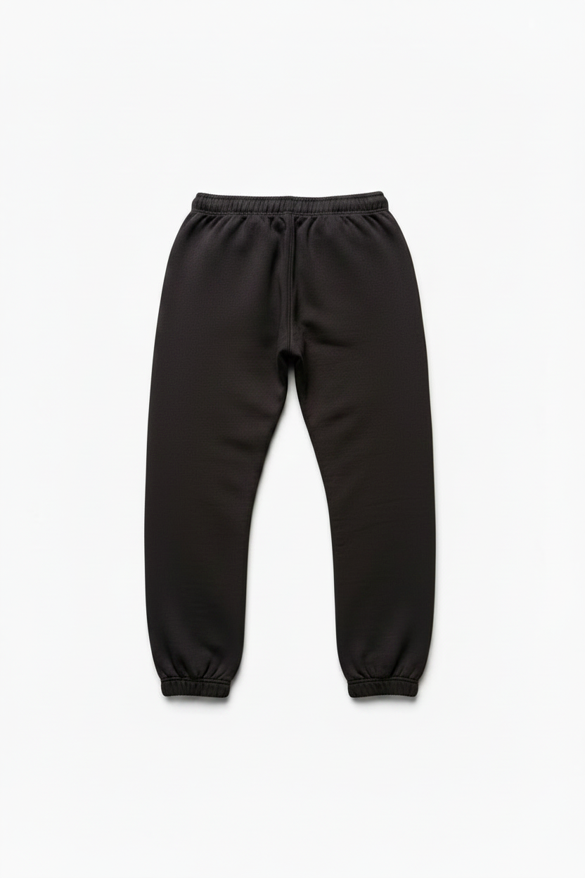 Black sweatpants with an elastic waistband and drawstring, displayed flat against a light gray background.