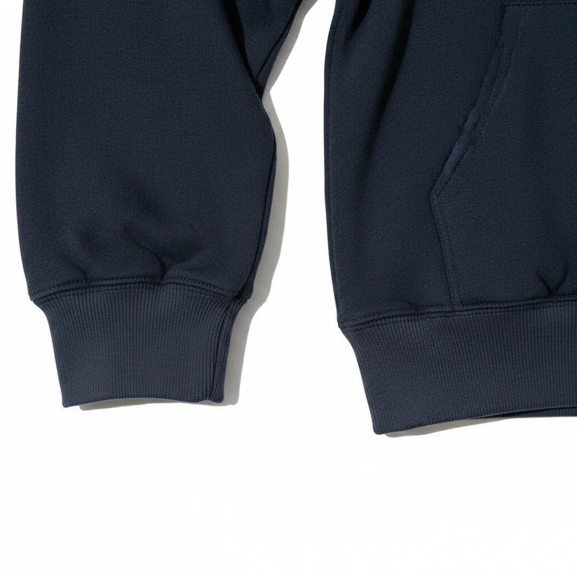Close-up of a navy blue sweatshirt showing the ribbed cuffs and a portion of the front pocket on a white background.